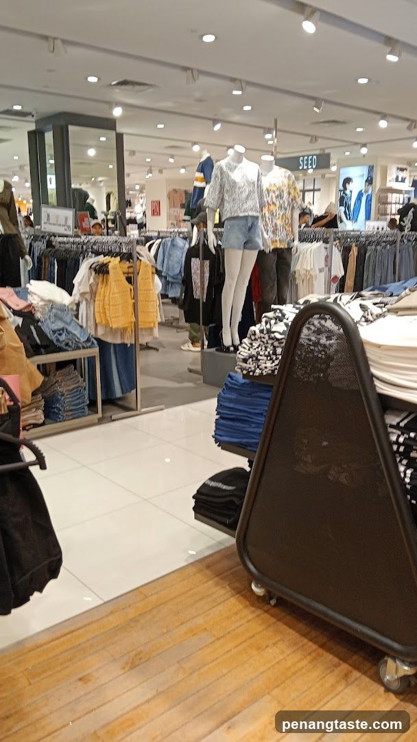 Clothing store interior with mannequins and apparel