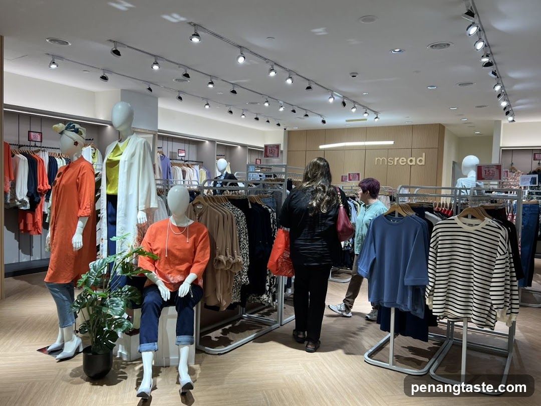 Clothing store interior with mannequins and shoppers