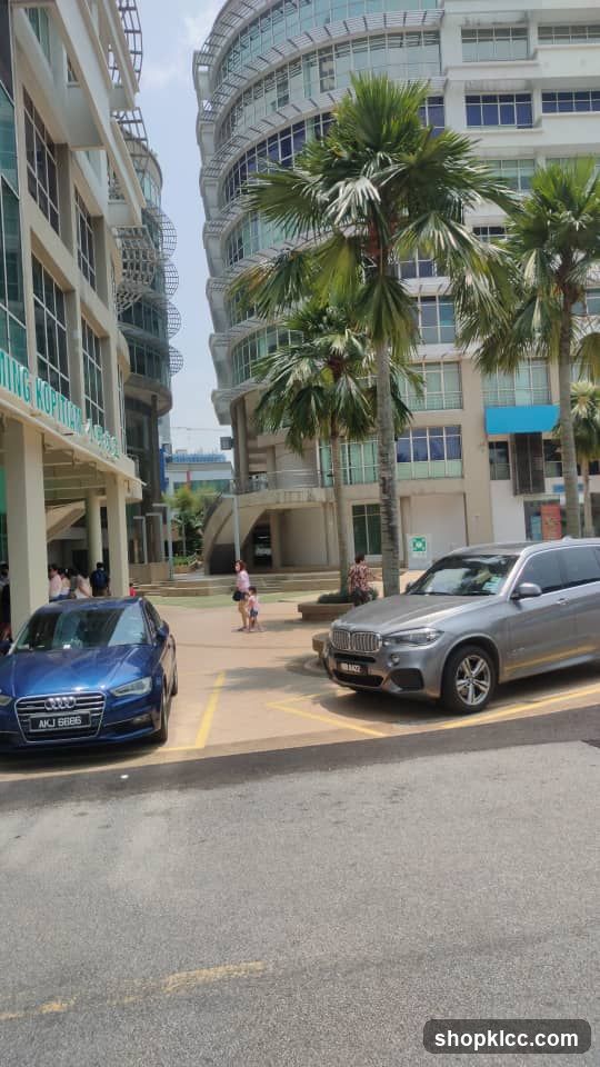 Parking Area with Cars and Buildings