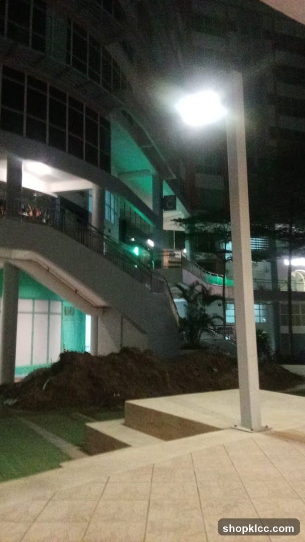 Night view of building exterior with construction area