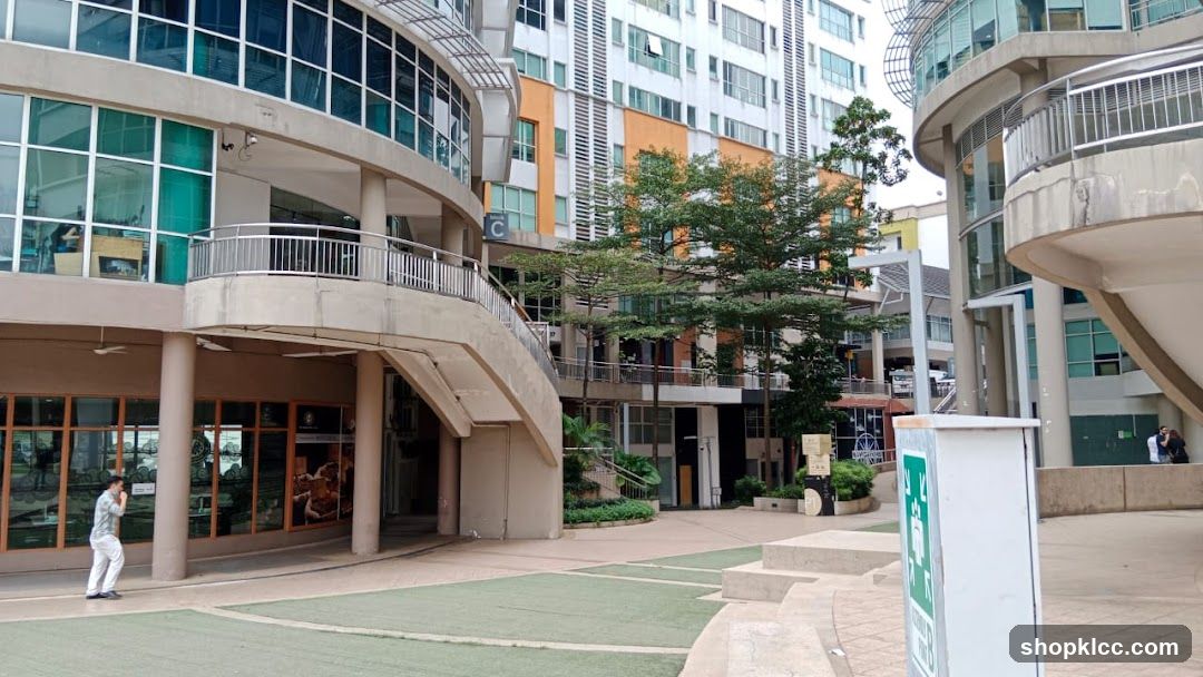 Modern Building Exterior with Walkway and Greenery