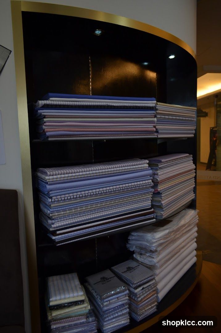 Stacks of folded fabric on shelves