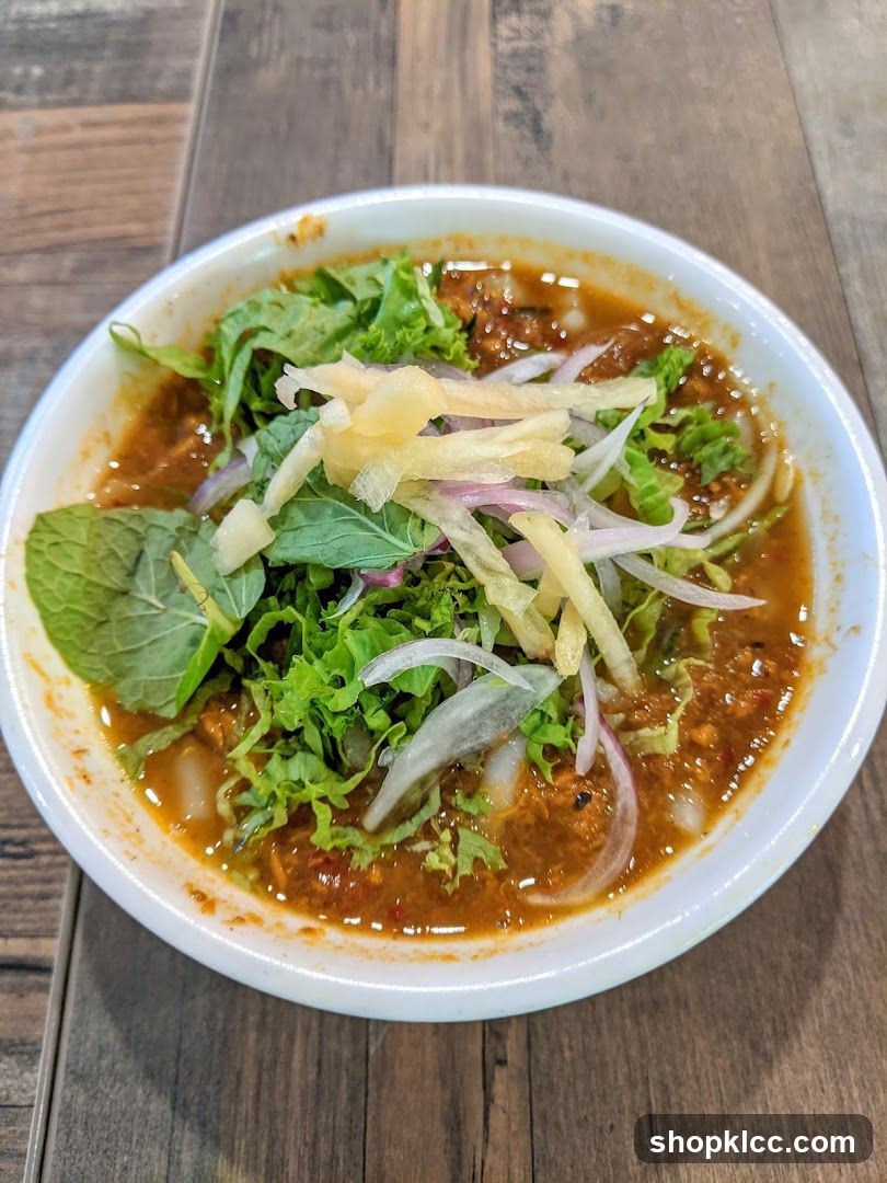 Bowl of Soup with Greens and Onions