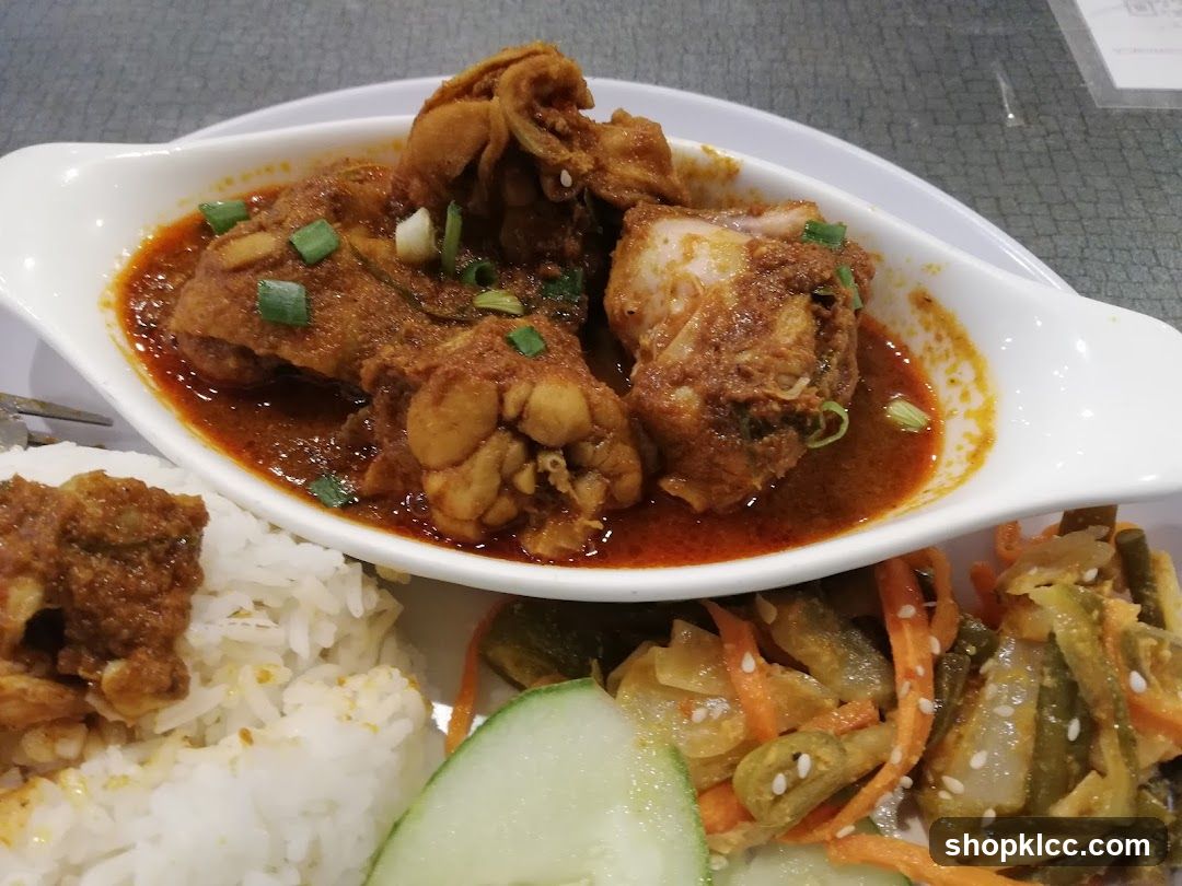 Curry Dish with Rice and Side Vegetables