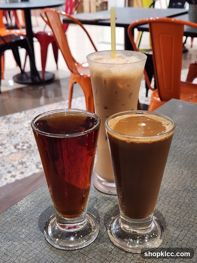 Three glasses of coffee drinks on a table