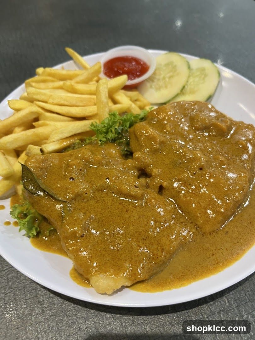 Curry Chicken with Fries and Cucumber