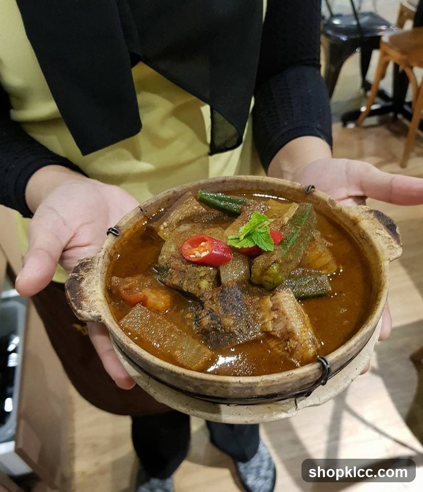 Serving Claypot Curry Dish