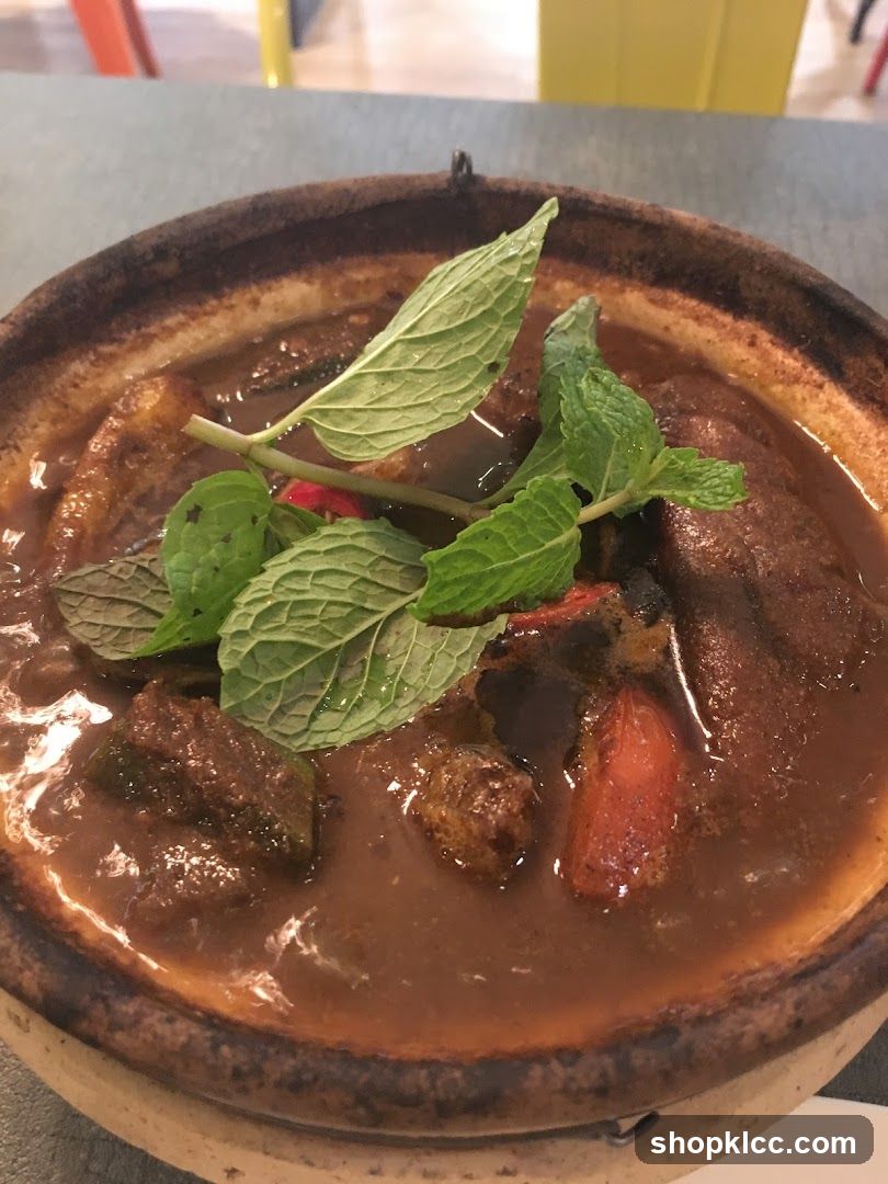 Casseroled Dish with Mint Garnish