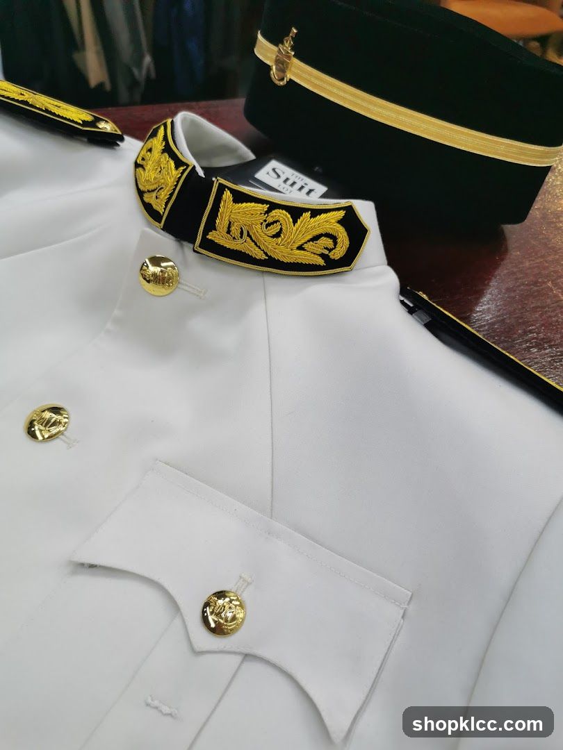 White Uniform with Gold Accents and Hat