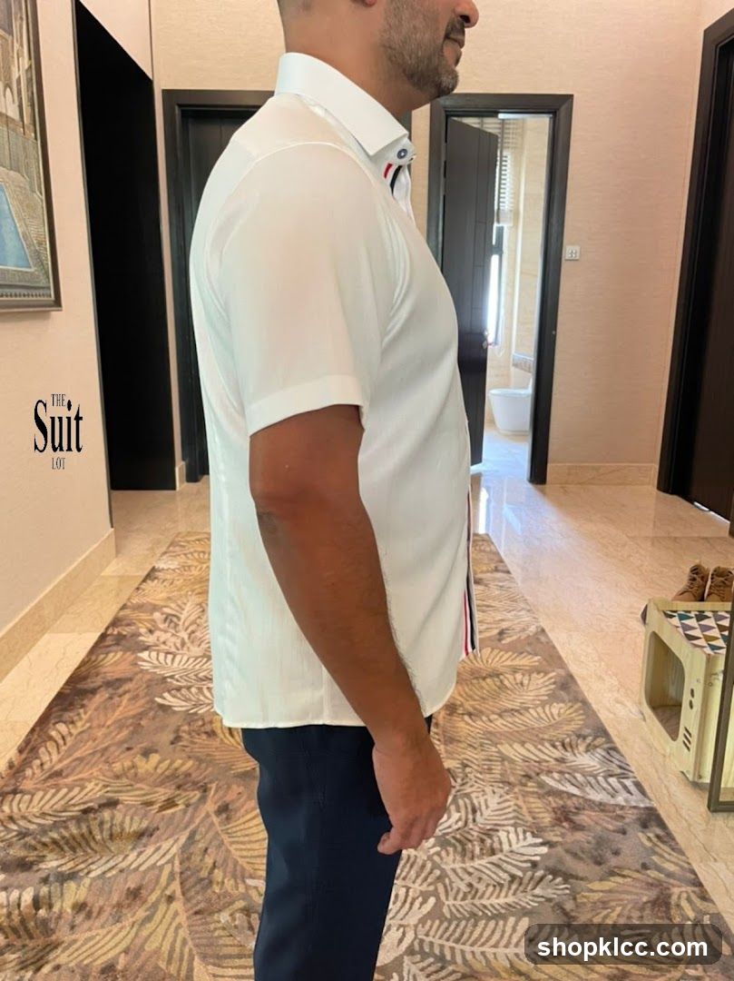 Man in White Shirt and Dark Pants
