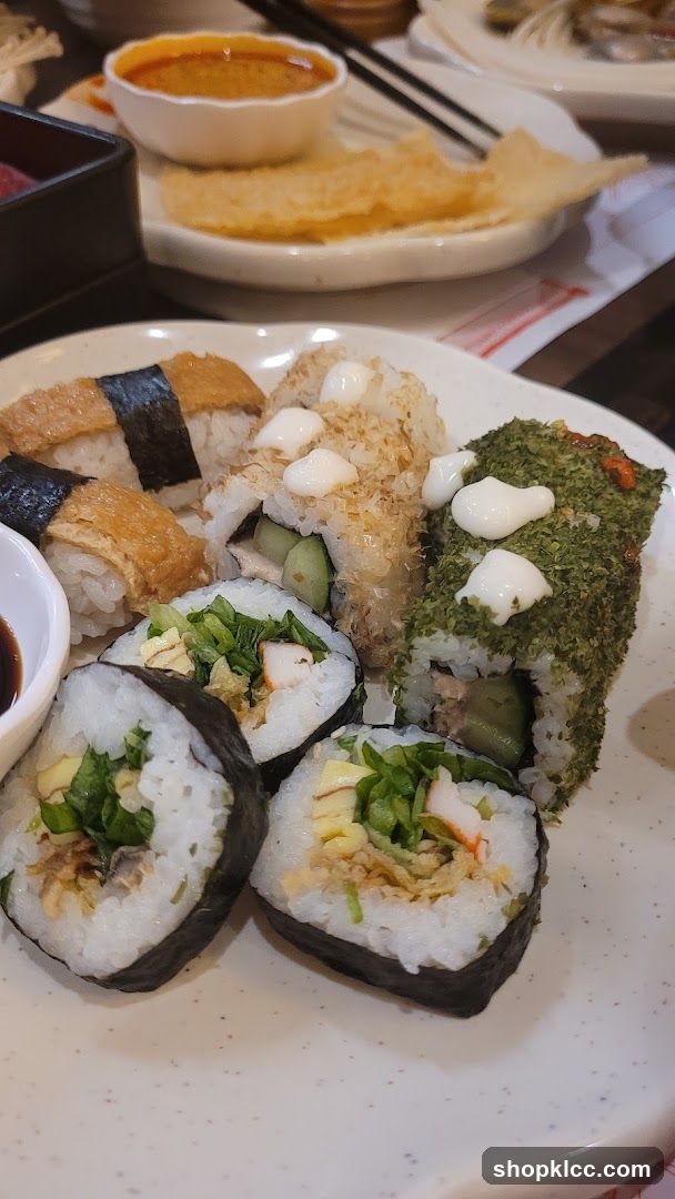 Sushi Platter with Various Rolls and Dipping Sauce