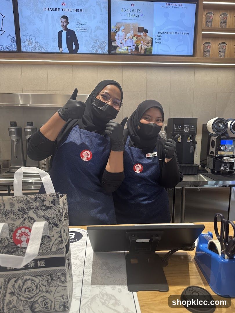 Tea Shop Staff Giving Thumbs Up
