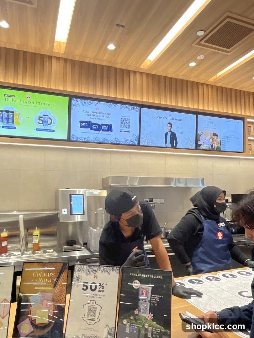 Coffee Shop Interior with Staff and Promotional Displays
