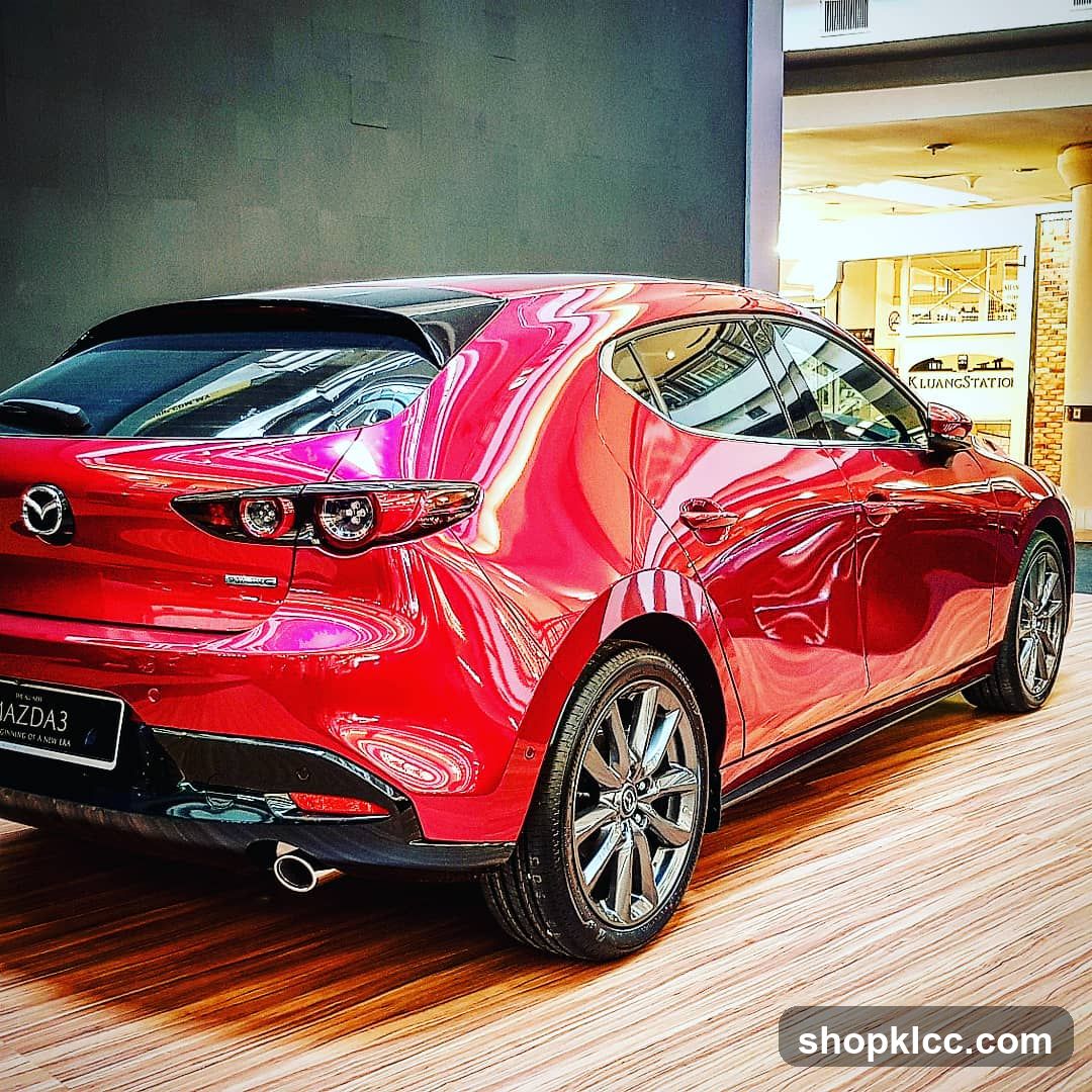 Red Mazda 3 in showroom