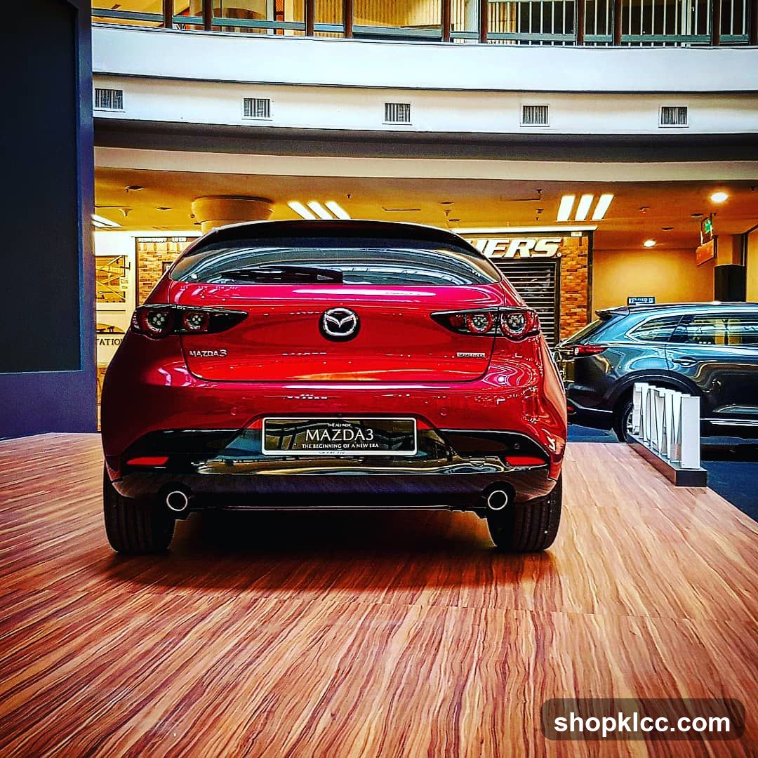 Red Mazda3 in showroom