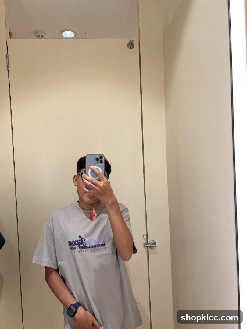 Person in a T-shirt in a Fitting Room