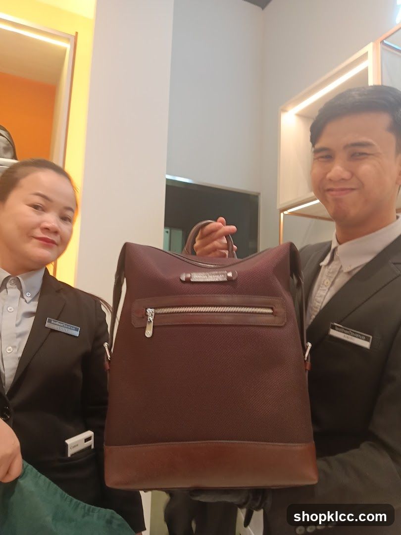 Staff Displaying Leather Bag