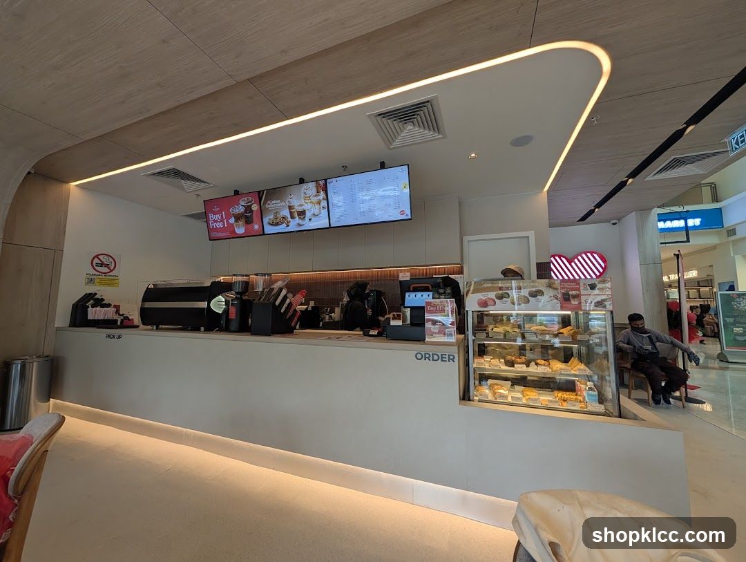 Cafe Counter with Pastries and Drinks