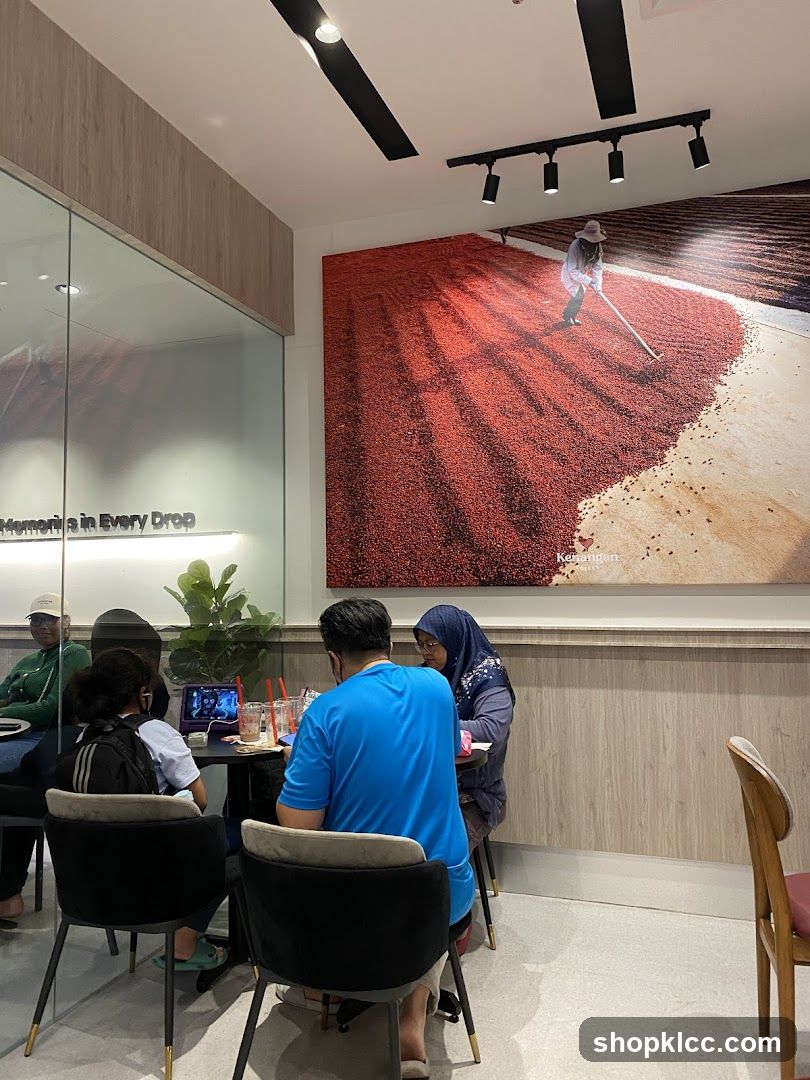 People sitting at tables in a cafe