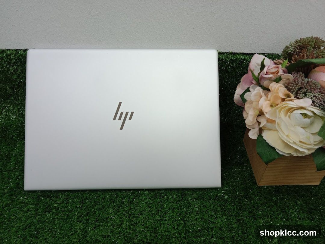 HP Laptop with Floral Arrangement