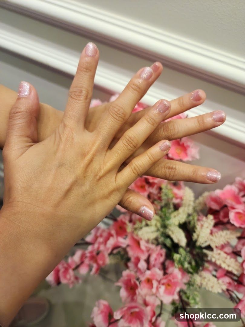Manicured Hands with Pink Flowers