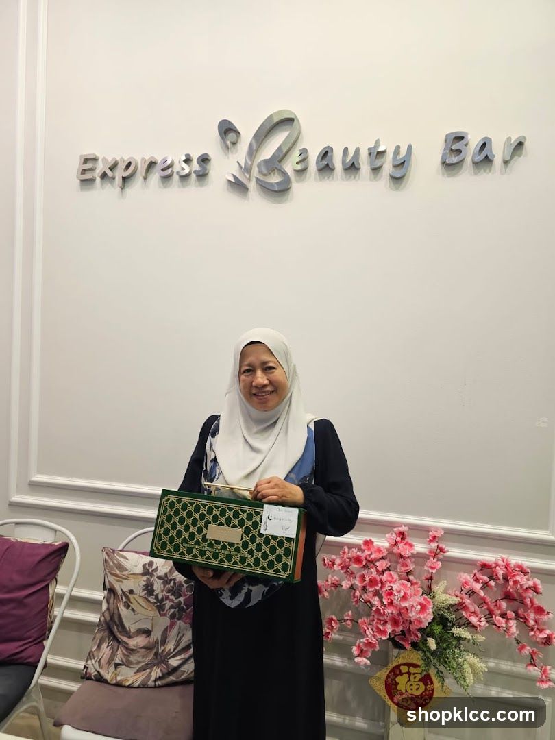 Woman Holding a Gift Box at Express Beauty Bar
