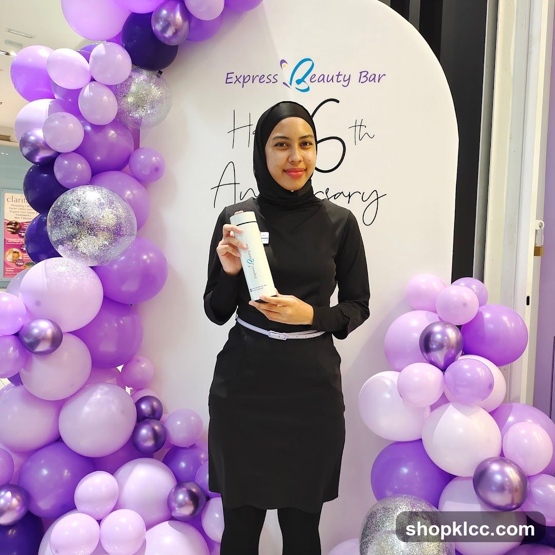 Woman holding a branded water bottle at an event