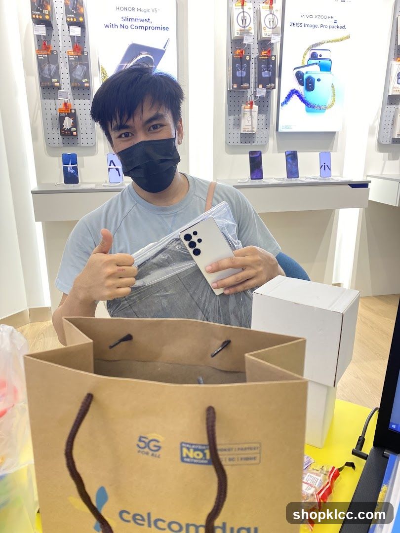 Man holding a new phone