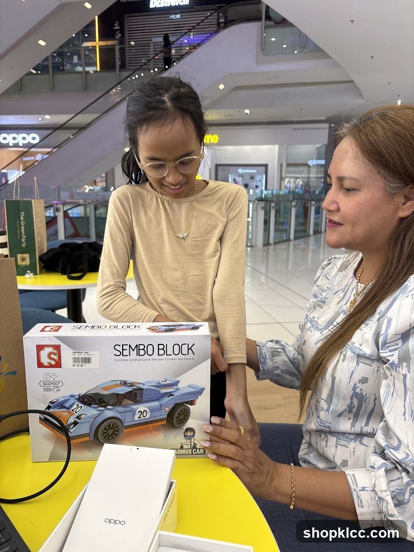 Mother and daughter looking at a toy car building block set