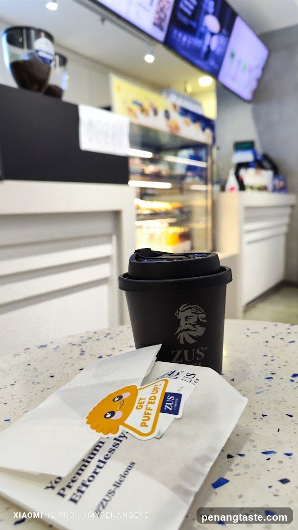 Coffee cup and pastry bag