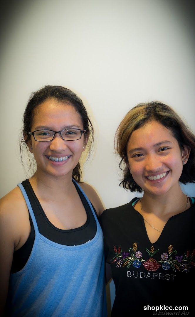 Two smiling women posing together