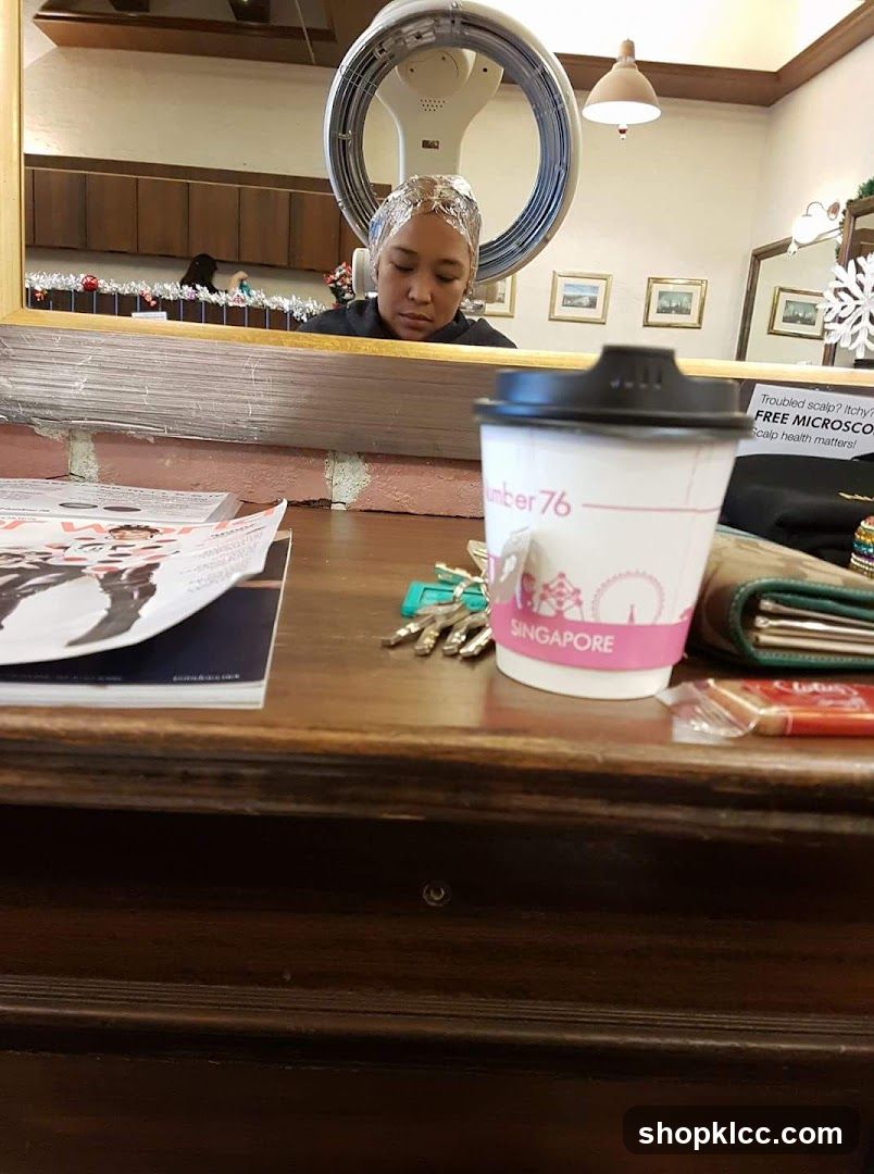 Woman under hair dryer