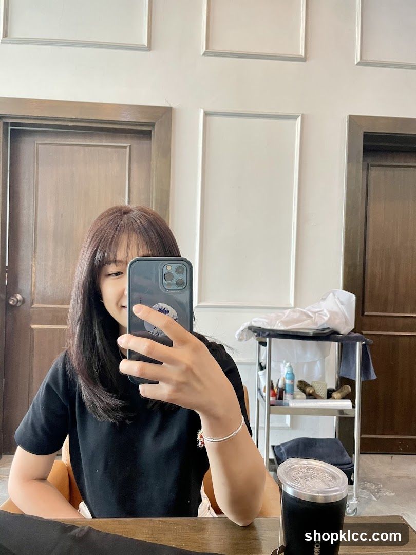 Woman taking a selfie in a salon