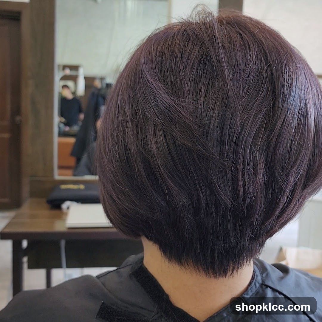 Back of a person's head with a bob haircut