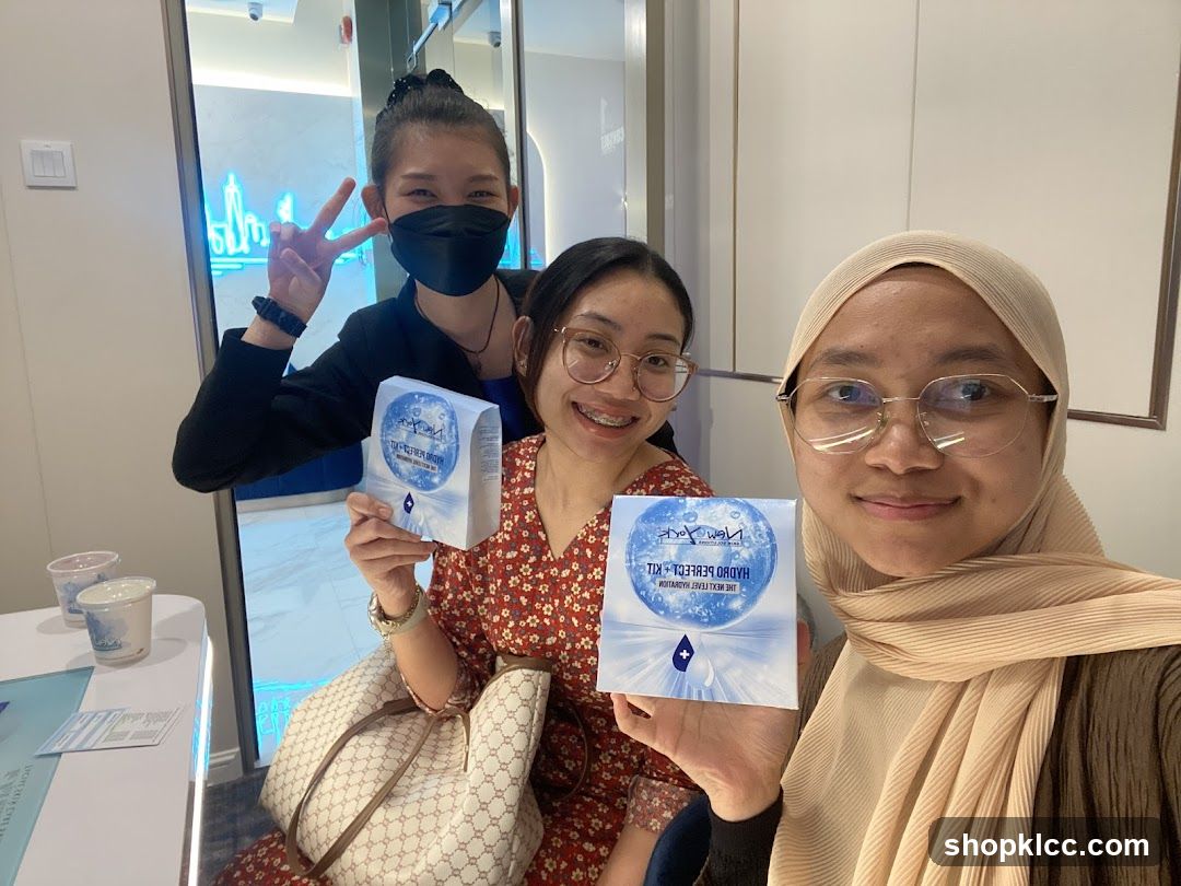 Three women holding product boxes