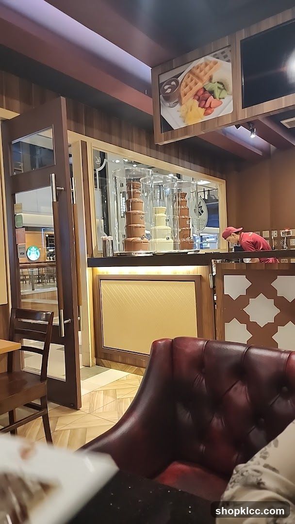 Dessert shop interior with chocolate fountains