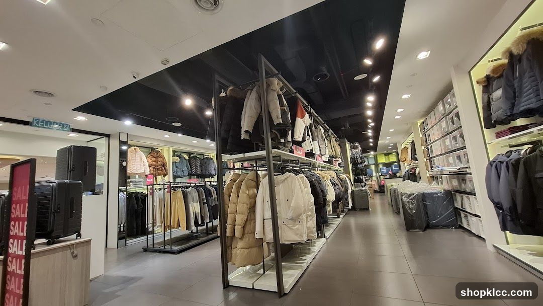 Clothing store interior with winter wear and luggage