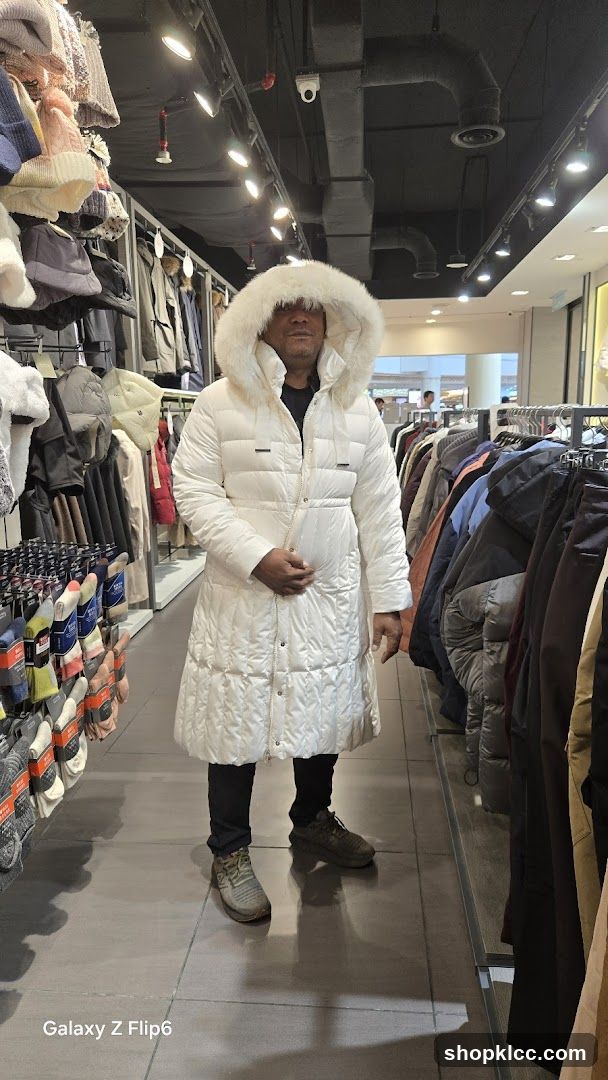 Man in White Puffer Coat in Clothing Store