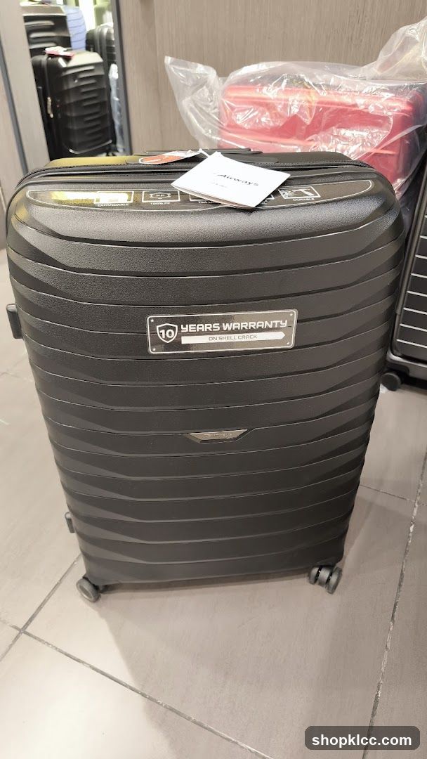 Black suitcase with warranty information