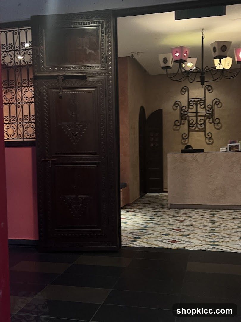 Interior of a building with ornate doors and a reception desk