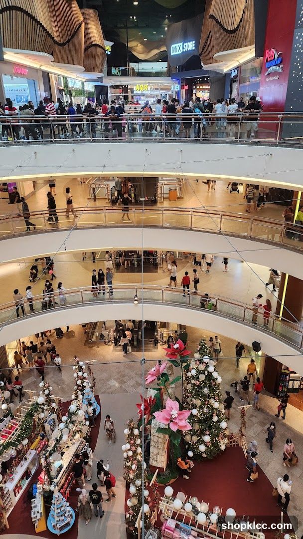Multi-level shopping mall interior with Christmas decorations