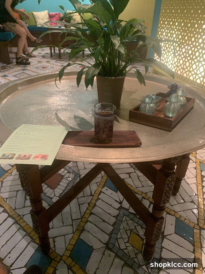 Table setting with a drink and small bottles