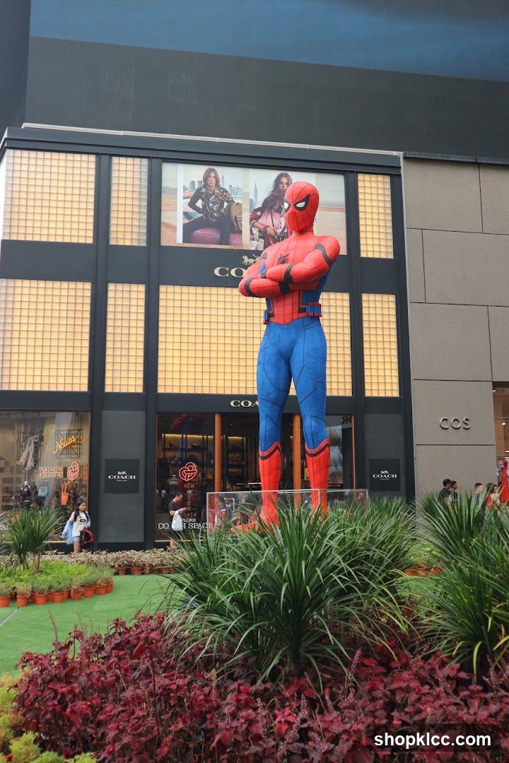 Giant Spiderman Statue in front of Coach and COS stores