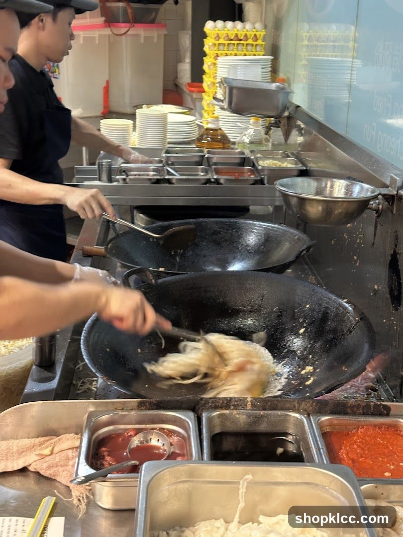 Chefs cooking in a busy kitchen