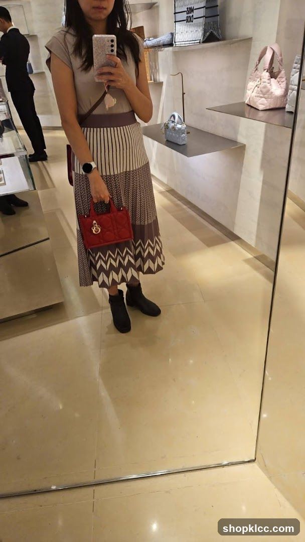 Woman holding a red handbag in a store