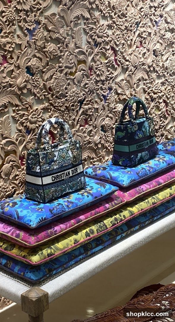 Dior handbags displayed on colorful cushions