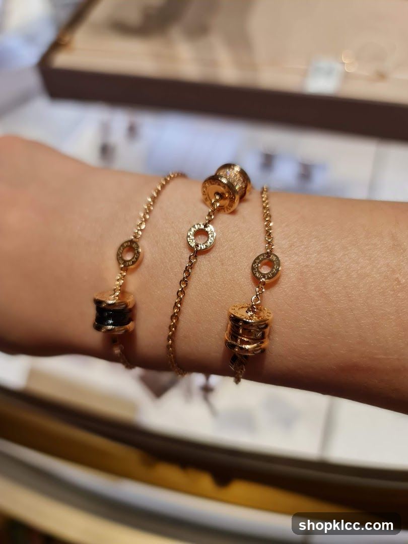 Gold bracelets with cylindrical charms