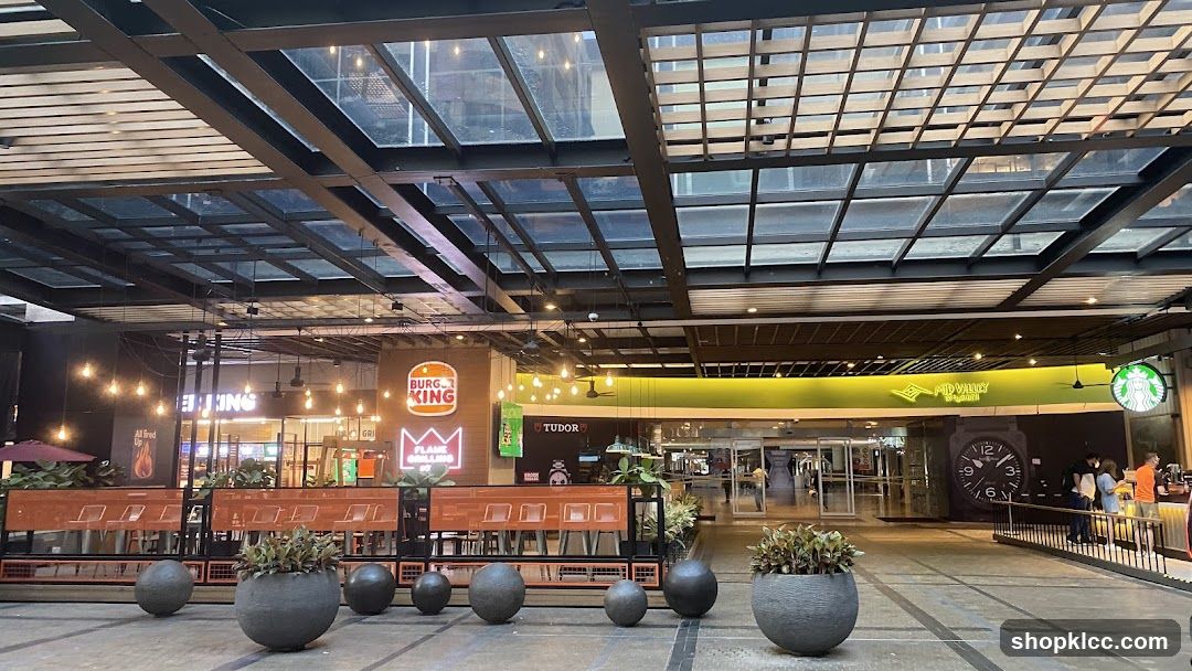 Outdoor dining area with Burger King and Starbucks