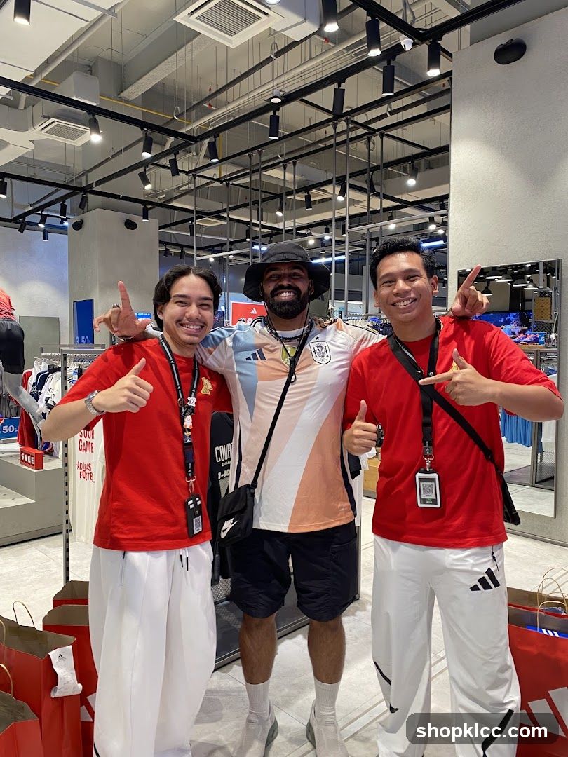 Three men posing in a store