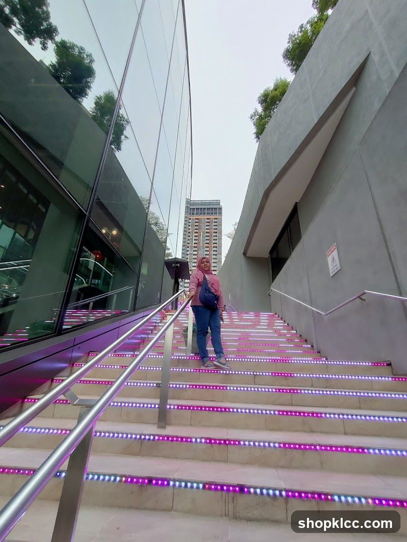 Woman on illuminated stairs
